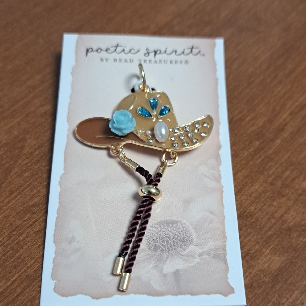 Gold-Tone Floral Cowgirl Hat Pendant with Blue Accents